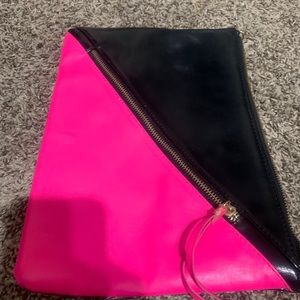 Black and hot pink clutch bag